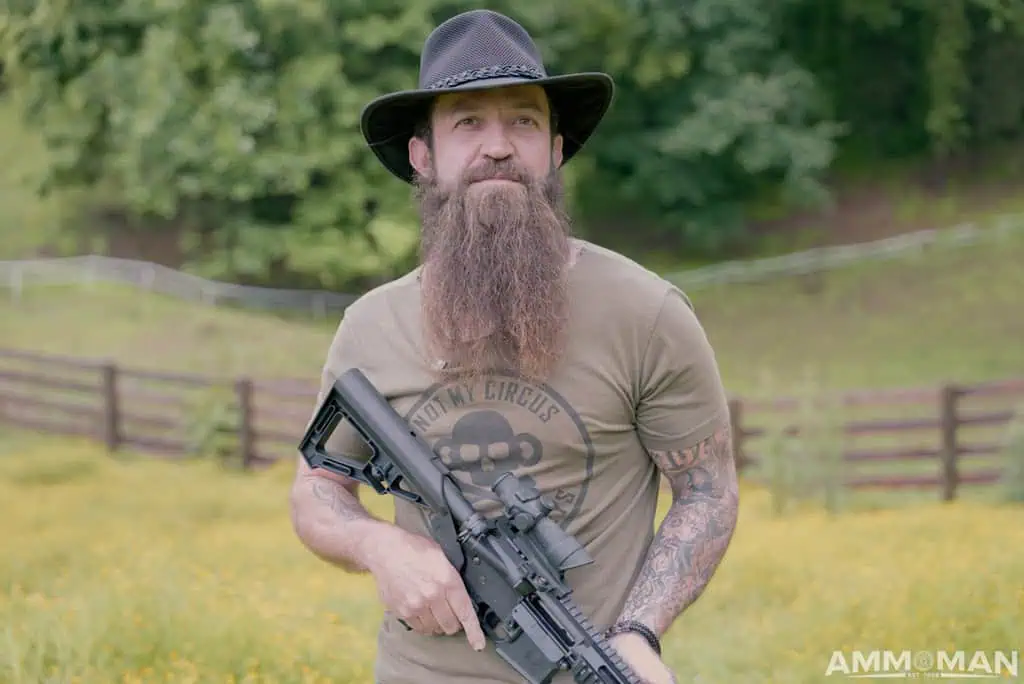 Jeremiah Cottle holding a rifle equipped with a Bump Stock.