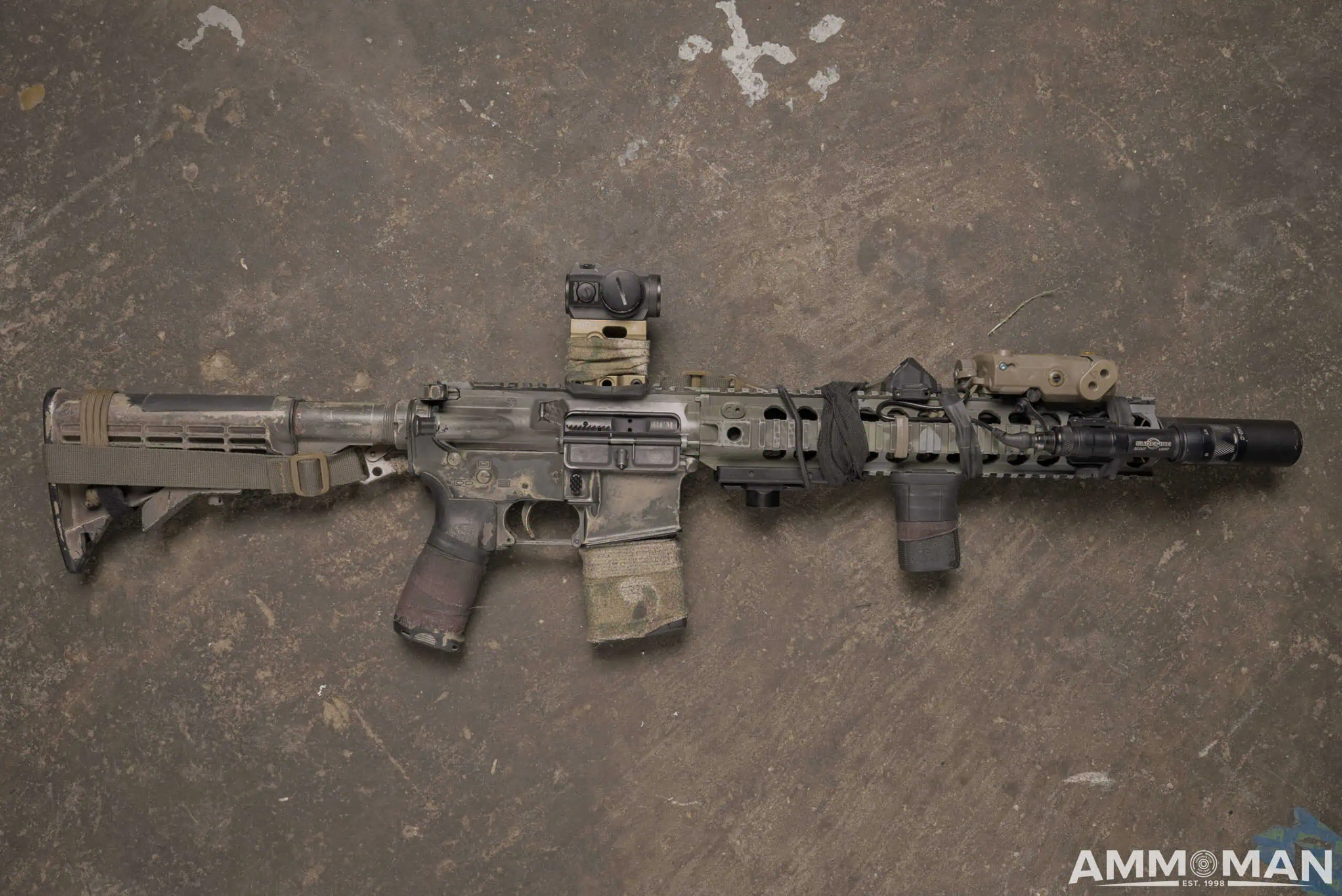 AR-15 hog rifle laying on ground