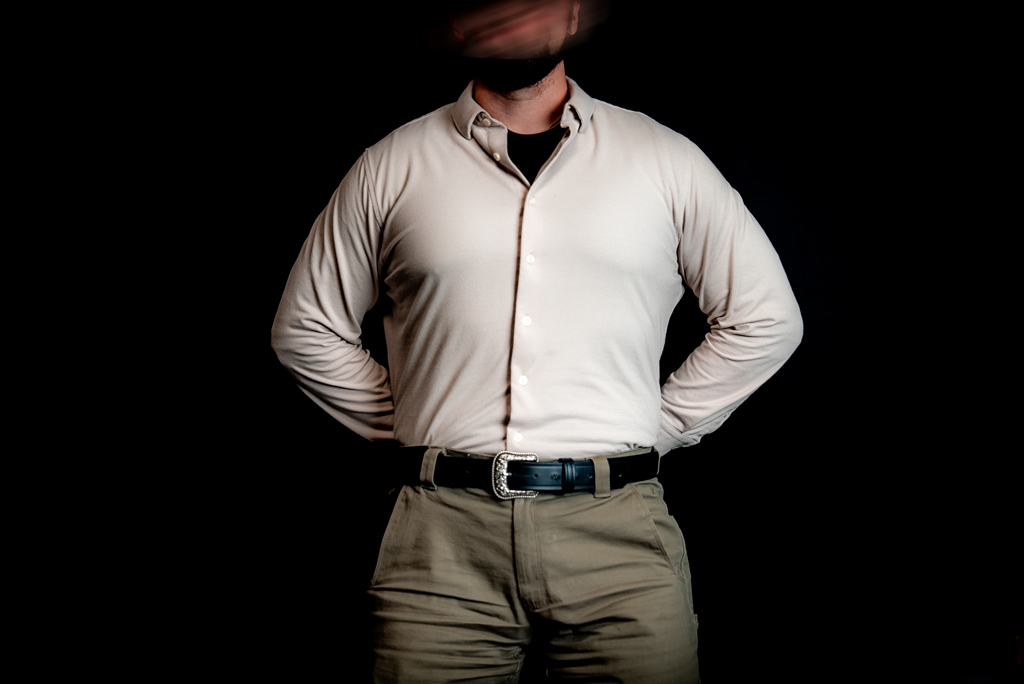 Man carrying a gun with a tucked shirt. Carrying a gun with a tucked shirt.