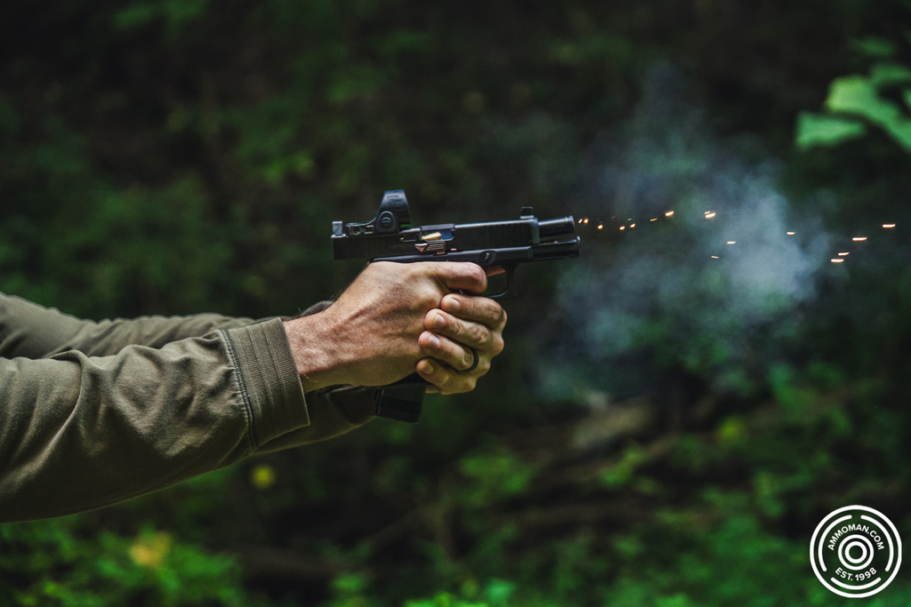 Firing a 9mm pistol at a shooting range