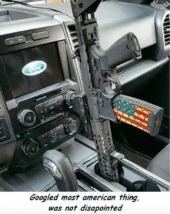 Yes, it’s a car holster, and it’s very, very American, but it’s still a bad idea