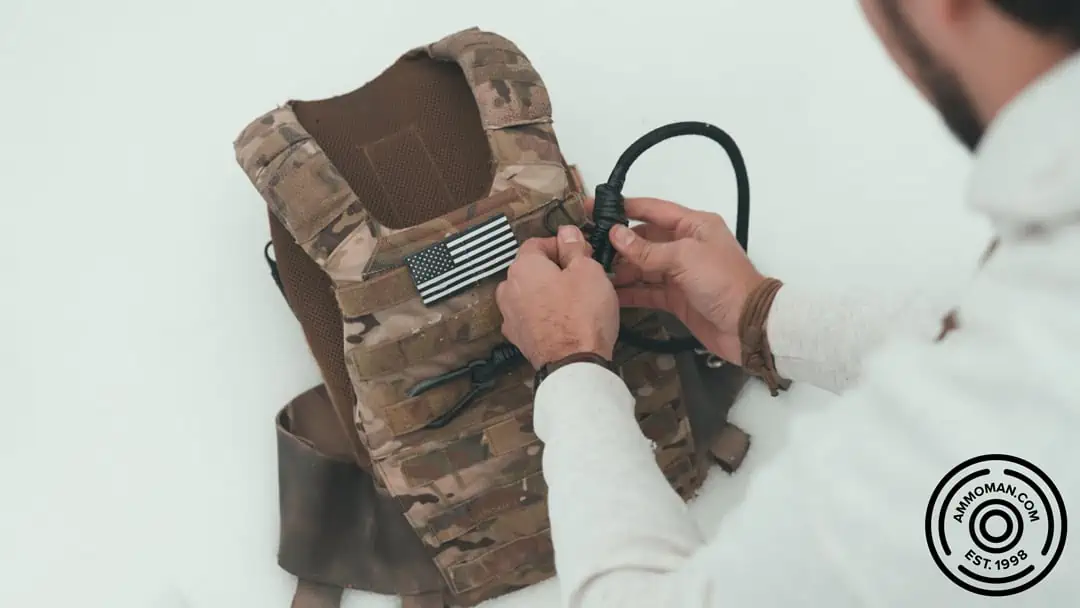 Mounting sling to MOLLE panel of plate carrier.