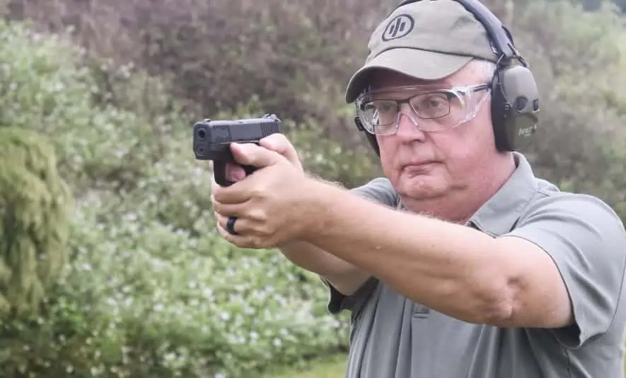 The author firing the Walter PPS M2 pistol at the shooting range