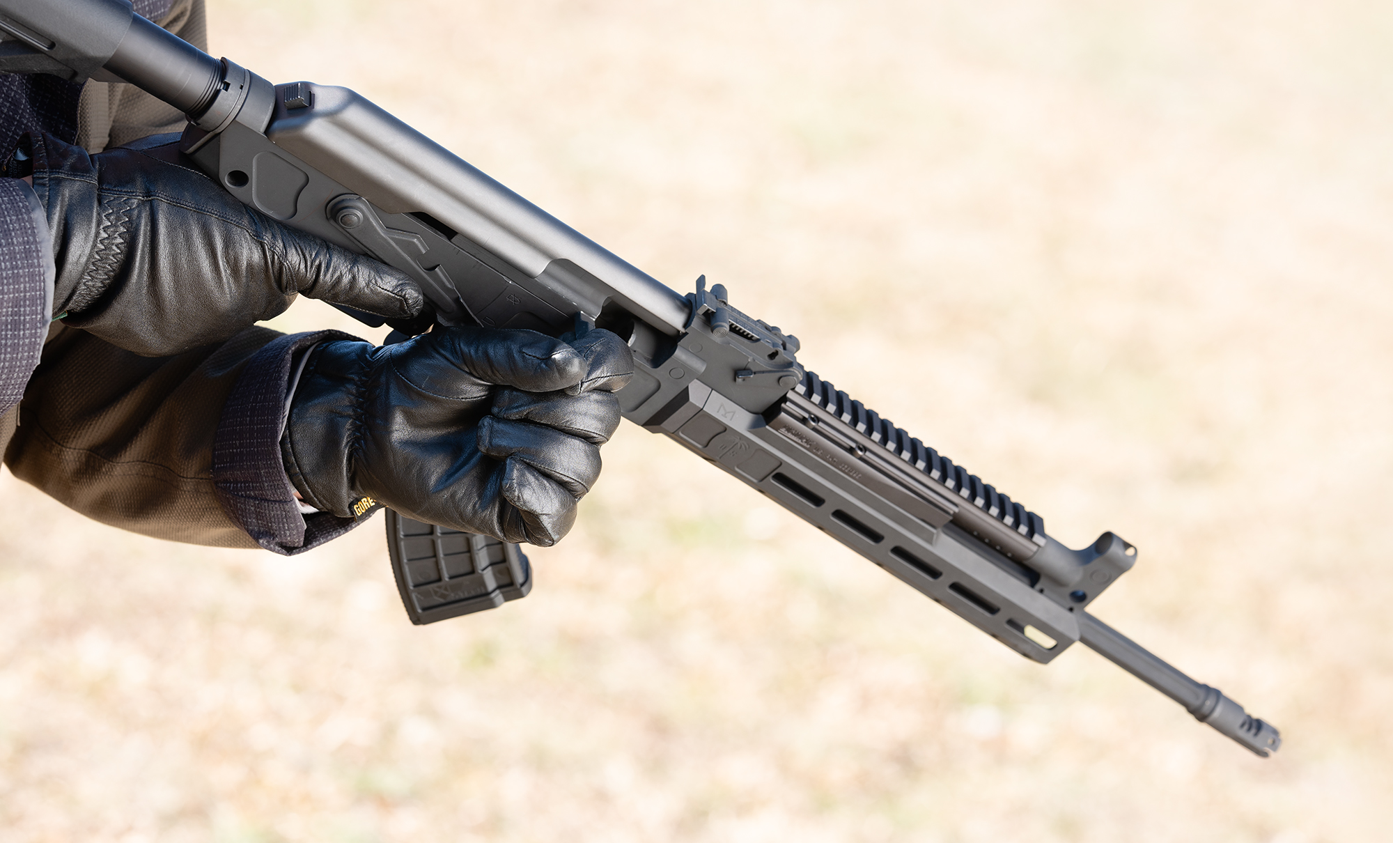 Close up of an AK-47 charging handle The charging handle of an AK-47 rifle at a shooting range