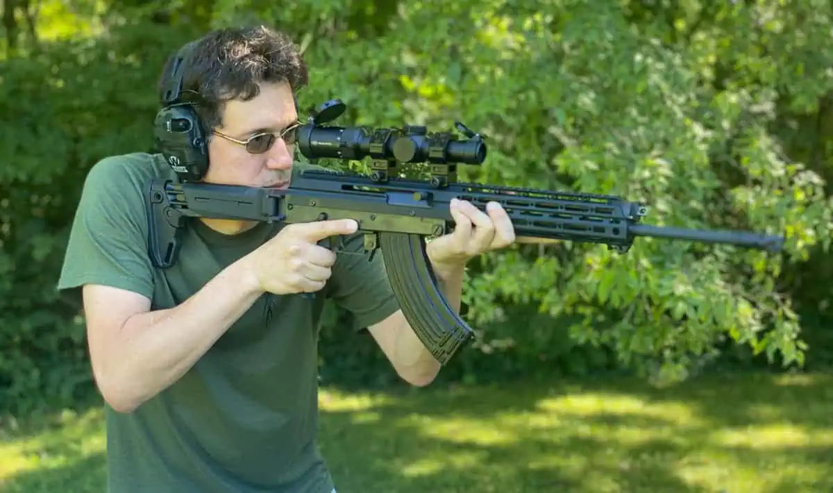 Oleg, the author, shooting an AK-47 and testing ammo at the range for accuracy.