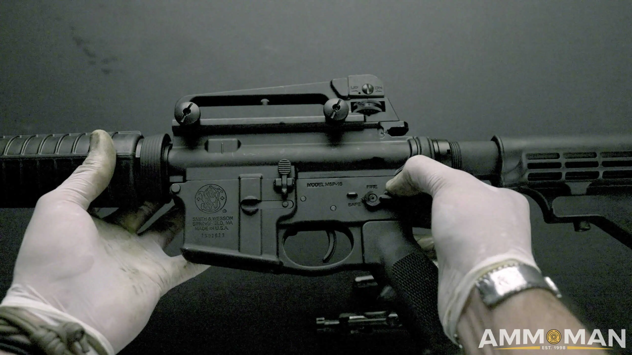 Pressing rear take-down pin of an AR15