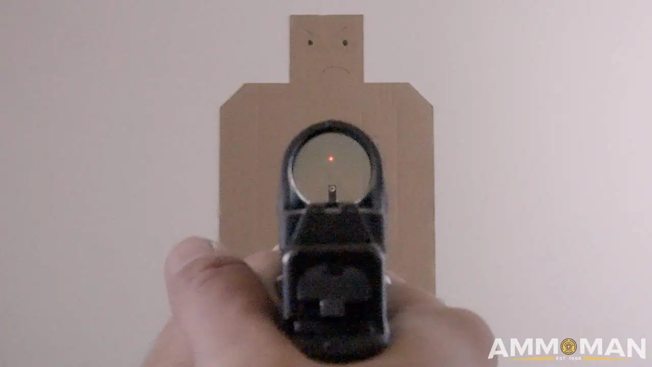 Aiming with a red dot on a pistol.