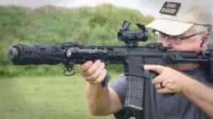 The author demonstrating scope eye relief at a shooting range