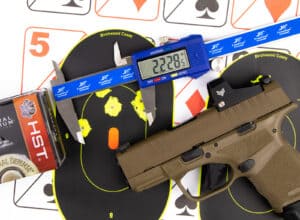 Testing the Springfield Armory OSP Accuracy with targets at a shooting range.