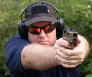 The author shooting the Springfield Armory OSP as part of this review.